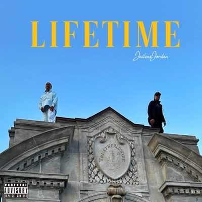 Lifetime cover art: two figures standing on the roof of a stone building