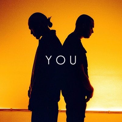 You cover art: two silhouettes back to back against orange light